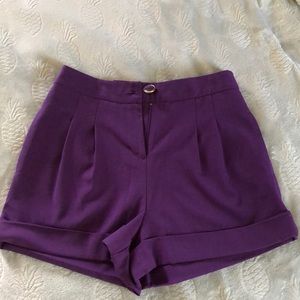 Purple high waisted shorts.